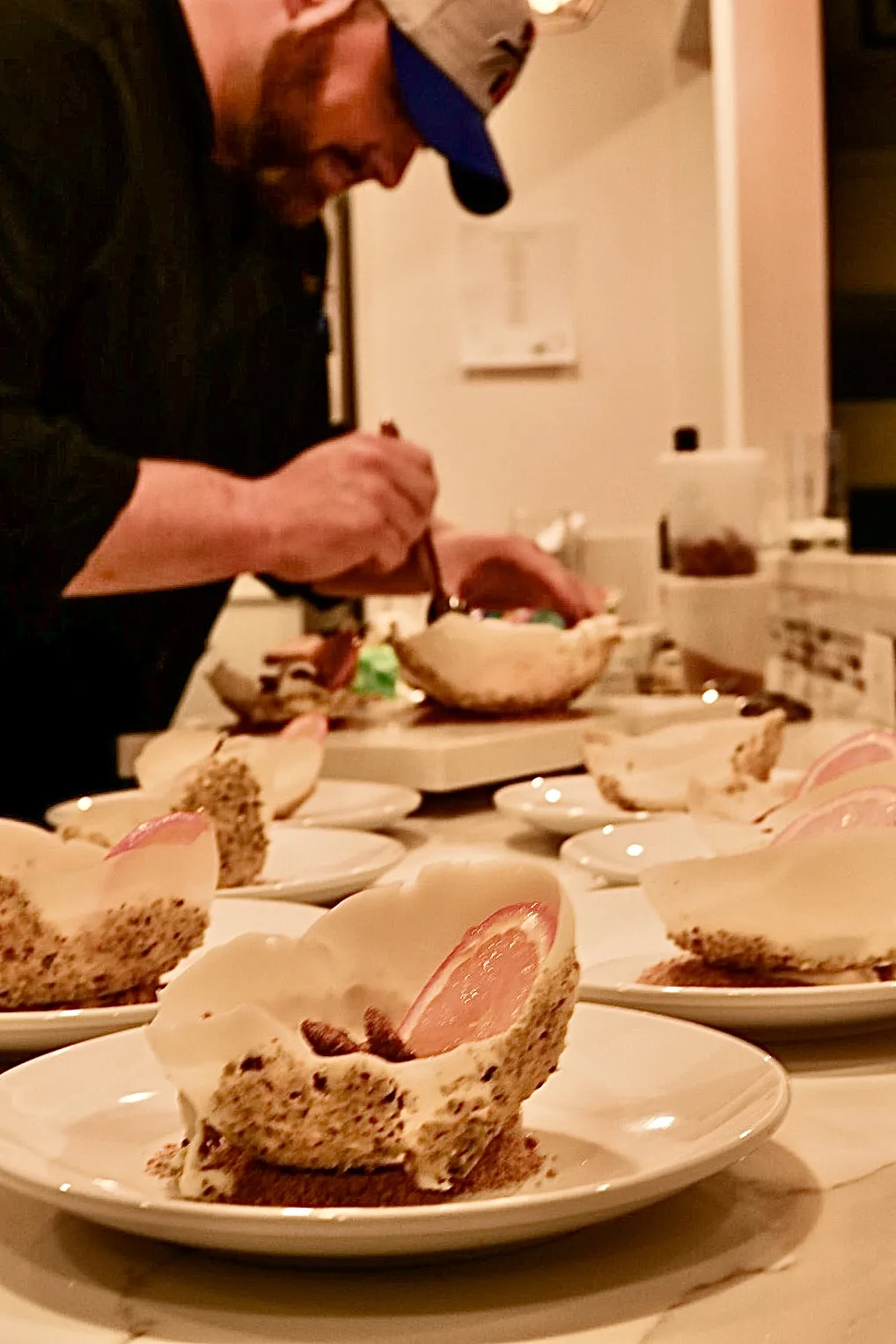 Chef Michael plating appetizers at the counter