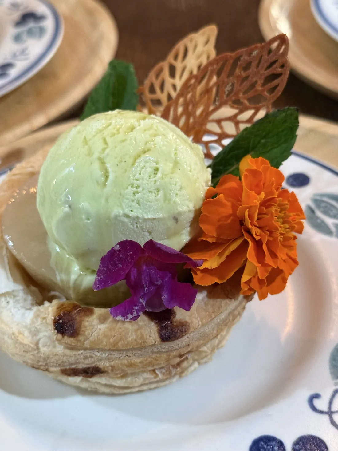 Green house-made ice cream finished with fresh flowers