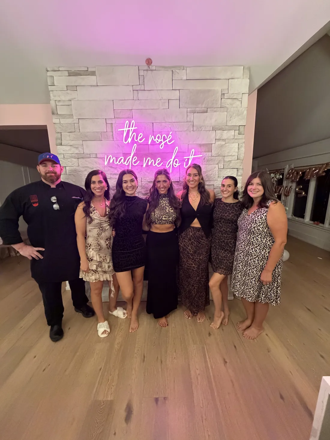 A group of guests with Chef Michael at a party
