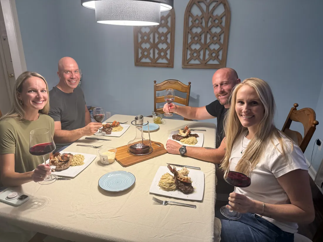 Friends around a dinner table after a lesson