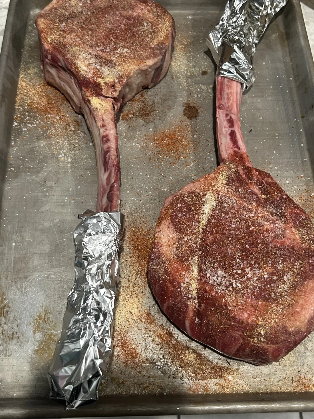 Tomahawk steaks on a carving board